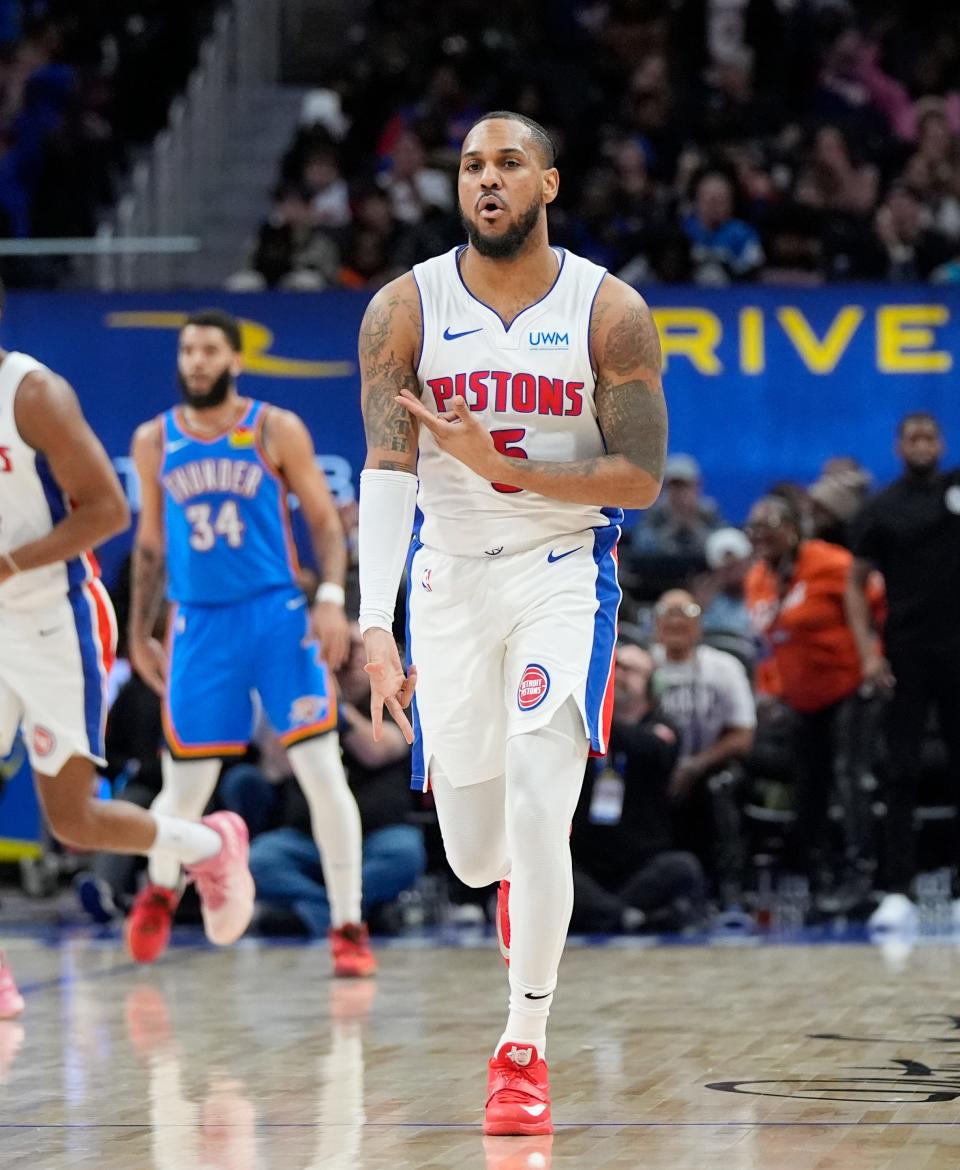 Detroit Pistons guard Monte Morris signals after a 3-point basket during the second half at Little Caesars Arena in Detroit on Sunday, Jan. 28, 2024.