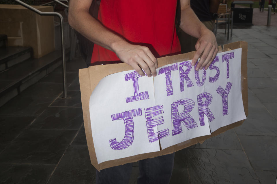 Garridy Hamilton, a freshmen in governments and policy, holds a sign reading "I trust Jerry" during a student protest on Friday, September 13, 2019 at Liberty University. (Emily Elconin/The News & Advance via AP)