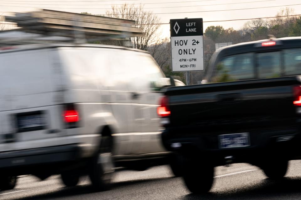 Signs mark an HOV lane on I-65 in Nashville, Tenn., Tuesday, Dec. 6, 2022.