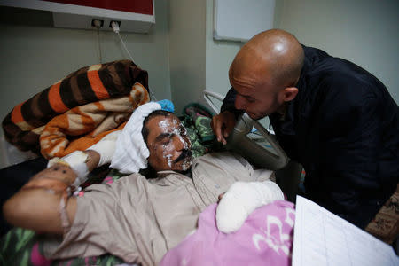 A displaced person who was injured in clashes and fled from Islamic State militants in Mousl, receives treatment at a hospital west of Erbil, Iraq, November 25, 2016. REUTERS/Azad Lashkari