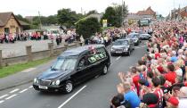 <p>The funeral cortege leaves St Joseph’s Church in Blackhall, County Durham following the funeral of Bradley Lowery </p>