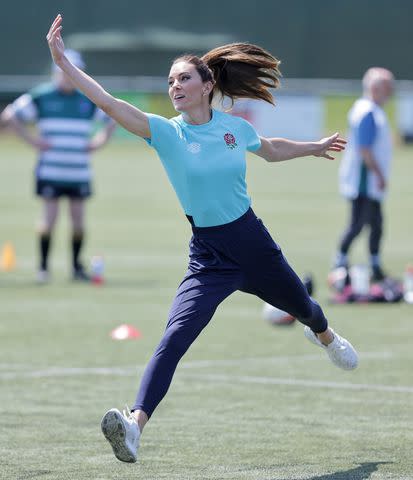 <p>Chris Jackson/Getty Images</p> Kate Middleton plays rugby in June 2023