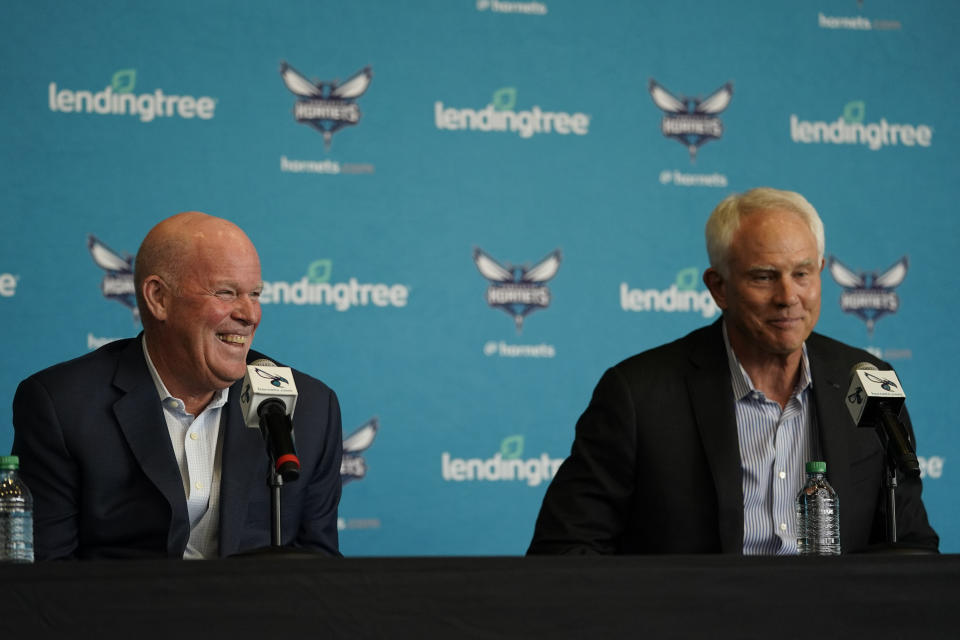 Charlotte Hornets NBA basketball team general manager Mitch Kupchak, right, and new head coach Steve Clifford share a light moment during a news conference on Tuesday, June 28, 2022, in Charlotte, N.C. (AP Photo/Chris Carlson)