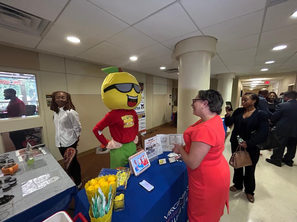 Ceydria McCray, left, founder of Breezzy's Lemonade, is dressed as her company's mascot while speaking with Rep. Jennifer McClellan, D-Virginia, Wednesday, Aug. 30, 2023, at Virginia State University in Ettrick. McClellan was on campus to visit with vendors, students and staff of the VSU Center for Entrepreneurship.