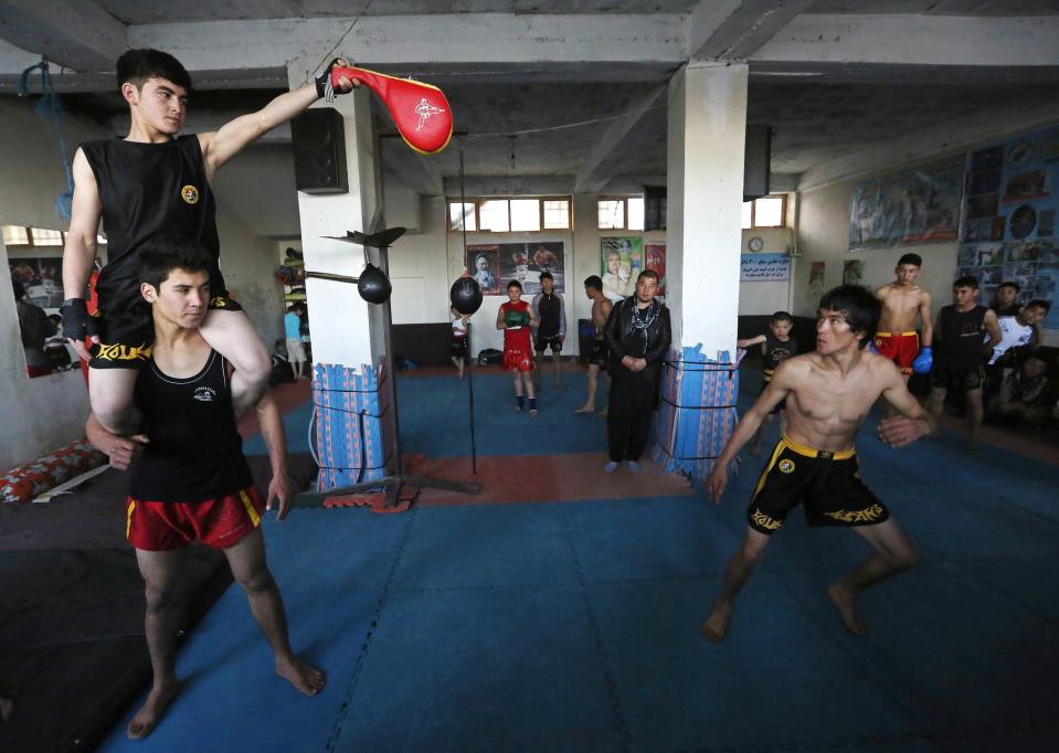 Abbas Alizada, who calls himself the Afghan Bruce Lee, works out during a media event in Kabul