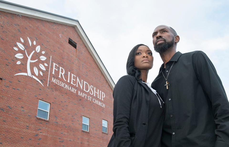 The Rev. LuTimothy May, right, and his wife, Ebony Lang May, stand outside Friendship Missionary Baptist Church in Brownsville on Wednesday.