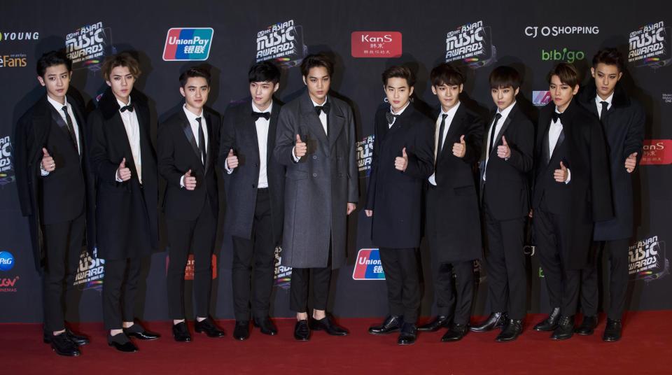 South Korean pop groups EXO-K and EXO-M, consisting of members from China and South Korea, pose on the red carpet as they attends the 2014 Mnet Asian Music Awards (MAMA) in Hong Kong