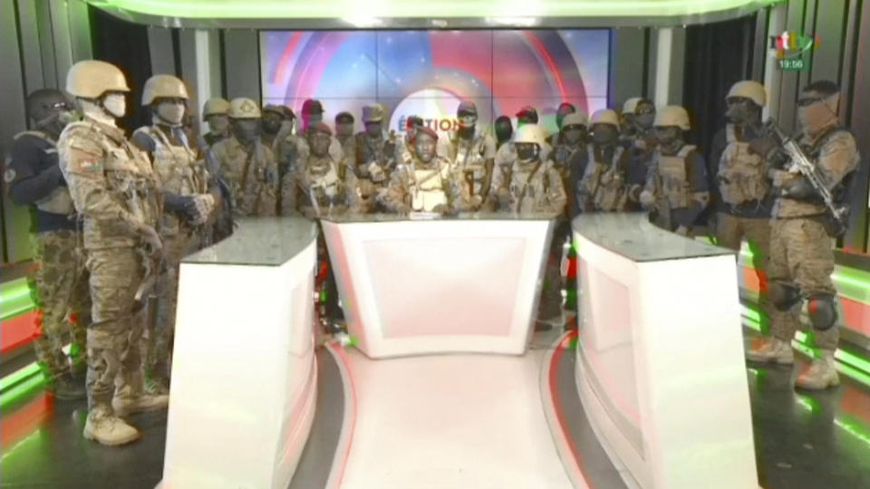 In this image from video broadcast by RTB state television, coup spokesman Capt. Kiswendsida Farouk Azaria Sorgho reads a statement in a studio in Ougadougou, Burkina Faso, on Friday evening, Sept. 30, 2022. Members of Burkina Faso's army seized control of state television late Friday, declaring that the country's coup leader-turned-president, Lt. Col. Paul Henri Sandaogo Damiba, had been overthrown after only nine months in power. The statement announced that Capt. Ibrahim Traore is the new military leader of Burkina Faso, a volatile West African country that is battling a mounting Islamic insurgency. (RTB via AP)