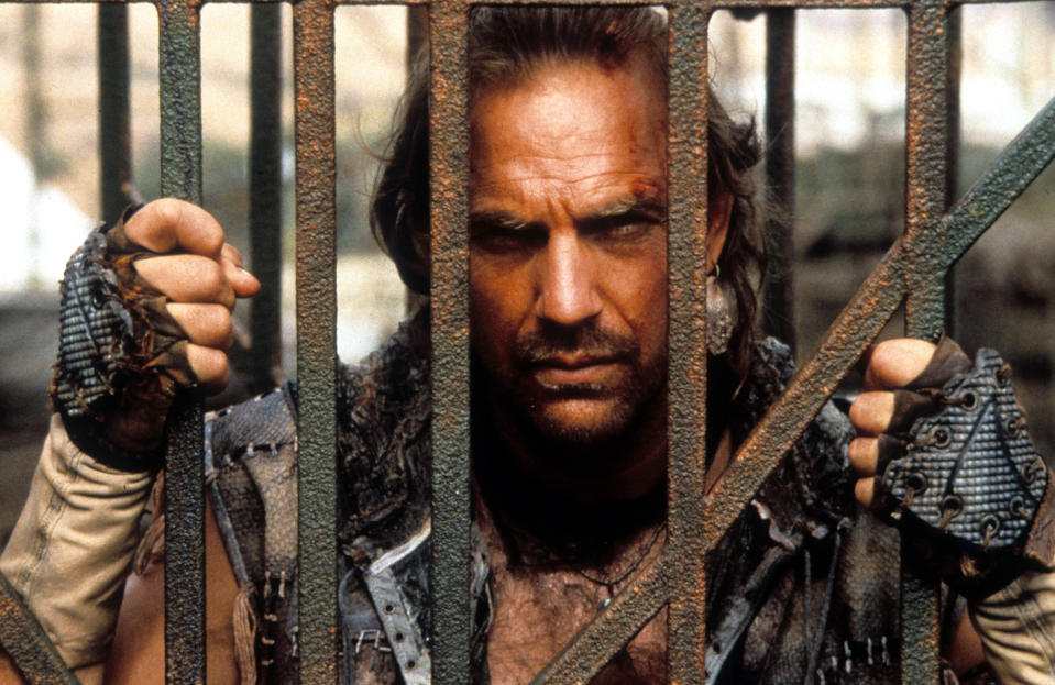 Kevin Costner behind bars in a scene from the film 'Waterworld', 1995. (Photo by Universal/Getty Images)