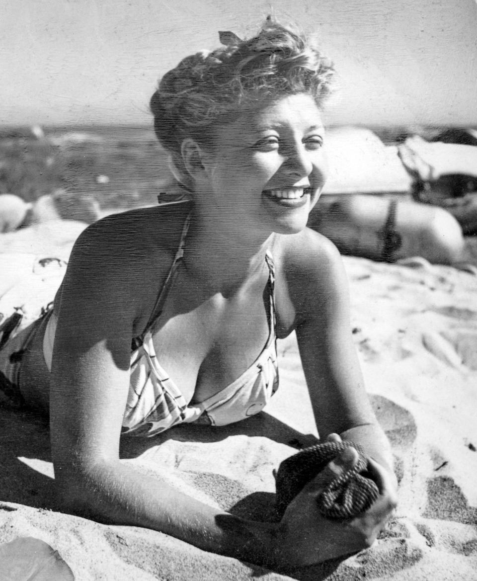 Dorothy Simpson Bridges relaxes on the beach when she was in her early 20s. 