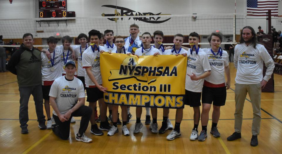 The Sauquoit Valley boys volleyball team poses with the Section III Championship banner after defeating Canastota in the Section III Class C finals Thursday, March 3, 2022.
