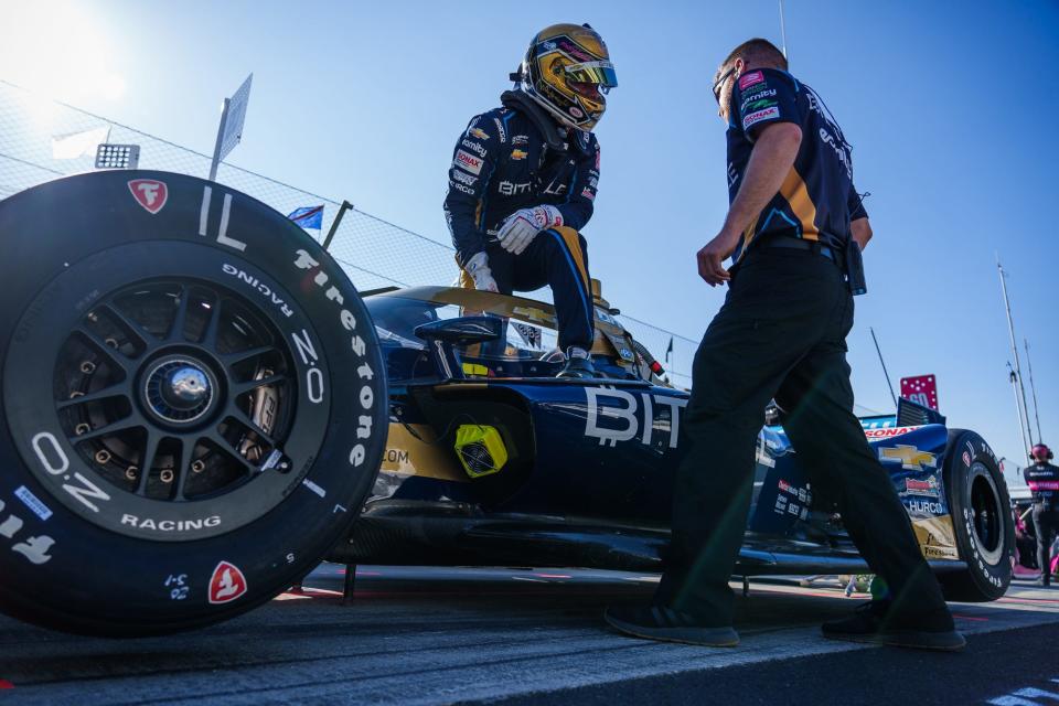 Ed Carpenter Racing driver Conor Daly (20) talks briefly with a team member Friday, May 13, 2022, prior to the first practice session for the GMR Grand Prix at Indianapolis Motor Speedway.