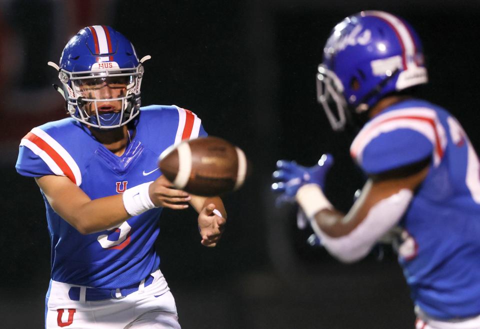 MUS quarterback George Hamsley pitches the ball to Hunter Barnes during their game against Christian Brothers at Hull-Dobbs Field on Friday, Oct. 15, 2021.