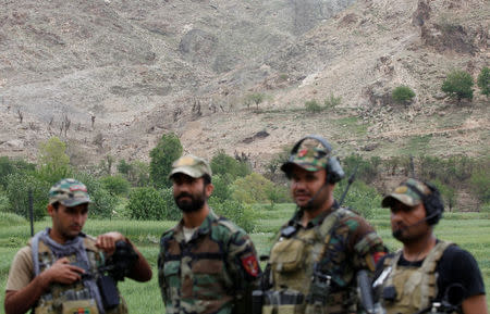 Afghan Special Forces patrol at the site of a MOAB, or ''mother of all bombs'', which struck the Achin district of the eastern province of Nangarhar, Afghanistan April 23, 2017. REUTERS/Parwiz