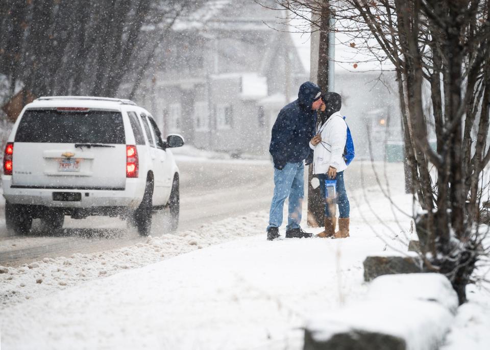 FITCHBURG - A couple leans in for a quick kiss while walking in the snow in Fitchburg, Massachusetts, during the storm on Monday, Dec. 30, 2019.