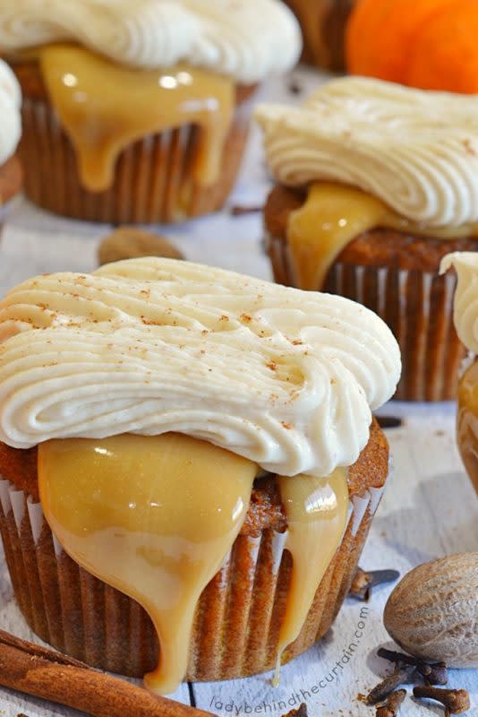 <p>Lady Behind the Curtain</p><p>Cupcakes are filled with pumpkin and espresso powder, a layer of caramel, topped with pumpkin spice latte frosting. </p><p><strong>Get the recipe:</strong><strong> <a href="https://www.ladybehindthecurtain.com/pumpkin-spice-caramel-latte-cupcakes/" rel="nofollow noopener" target="_blank" data-ylk="slk:Pumpkin Spice Caramel Latte Cupcakes;elm:context_link;itc:0;sec:content-canvas" class="link rapid-noclick-resp">Pumpkin Spice Caramel Latte Cupcakes</a></strong></p>