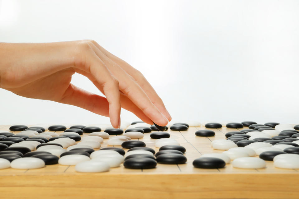 Chinese, Japan, Korean board game GO with black and white stone. Go or wei-Chi - WeiQi traditional asian board game