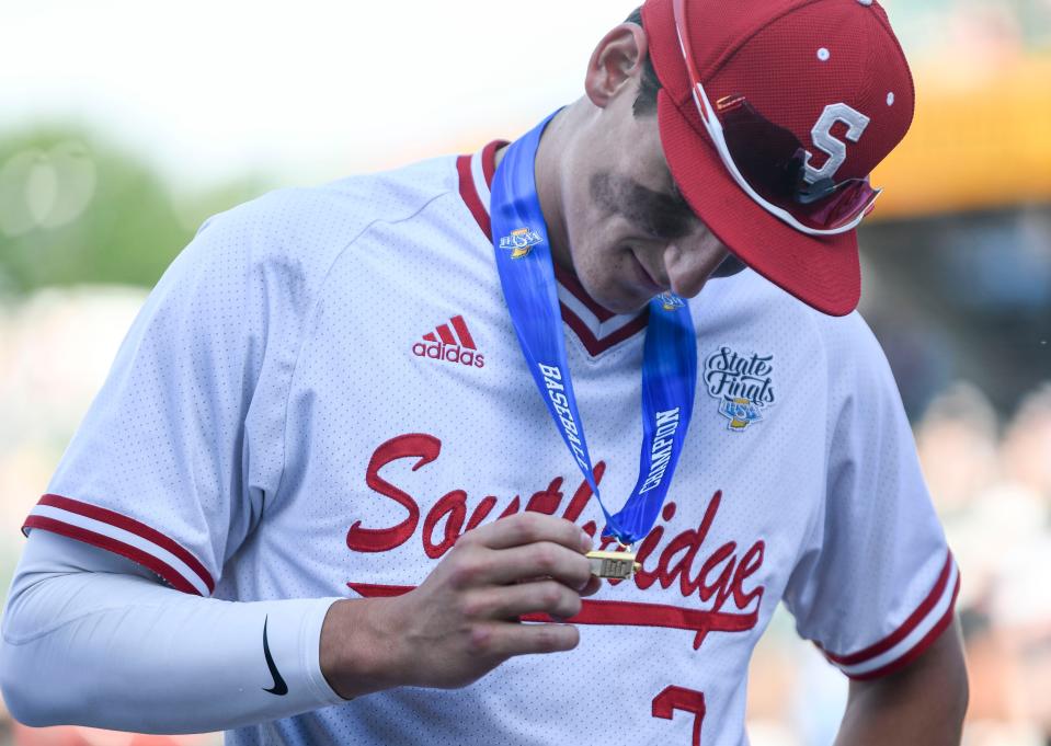 Colson Montgomery inspects his new championship medal following the Raiders' IHSAA Class 3A state championship win against the Hanover Central Wildcats at Victory Field in Indianapolis, Ind., Tuesday, June 22, 2021. The Southridge High School graduate and former nominee for USA TODAY High School Sports Awards baseball player of the year has been named the top prospect in the Chicago White Sox farm system by Baseball America.