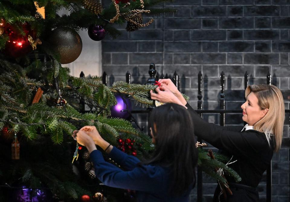 The pair hung decorations on a Christmas tree outside of 10 Downing Street (AFP via Getty Images)