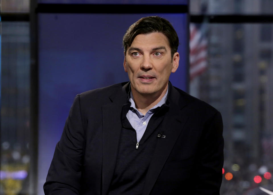FILE - In this Dec. 3, 2014, file photo, AOL CEO Tim Armstrong is interviewed during "Opening Bell with Maria Bartiromo," on the Fox Business Network, in New York. Shares of Verizon are falling before the opening bell after the company said it would take a $4.6 billion hit for what’s become an expensive internet foray with Yahoo and AOL. The two companies, which came to be called Oath under Verizon, has yet to pan out. In September, Verizon announced that Oath CEO Armstrong was leaving. (AP Photo/Richard Drew, File)
