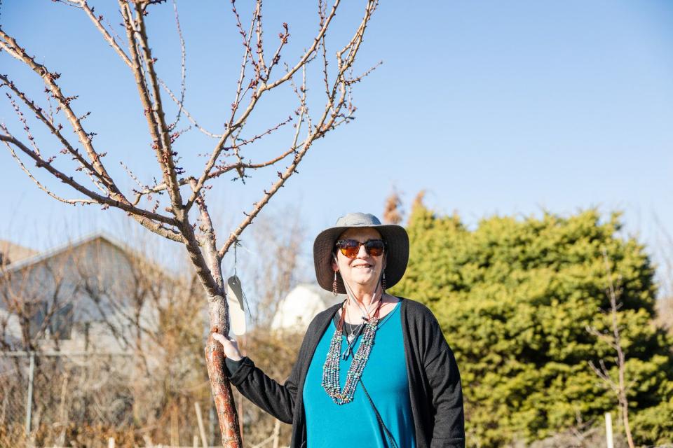 Dee Taylor, a garden volunteer, poses for a portrait at the Og-Woi People's Garden in Salt Lake City on April 10.