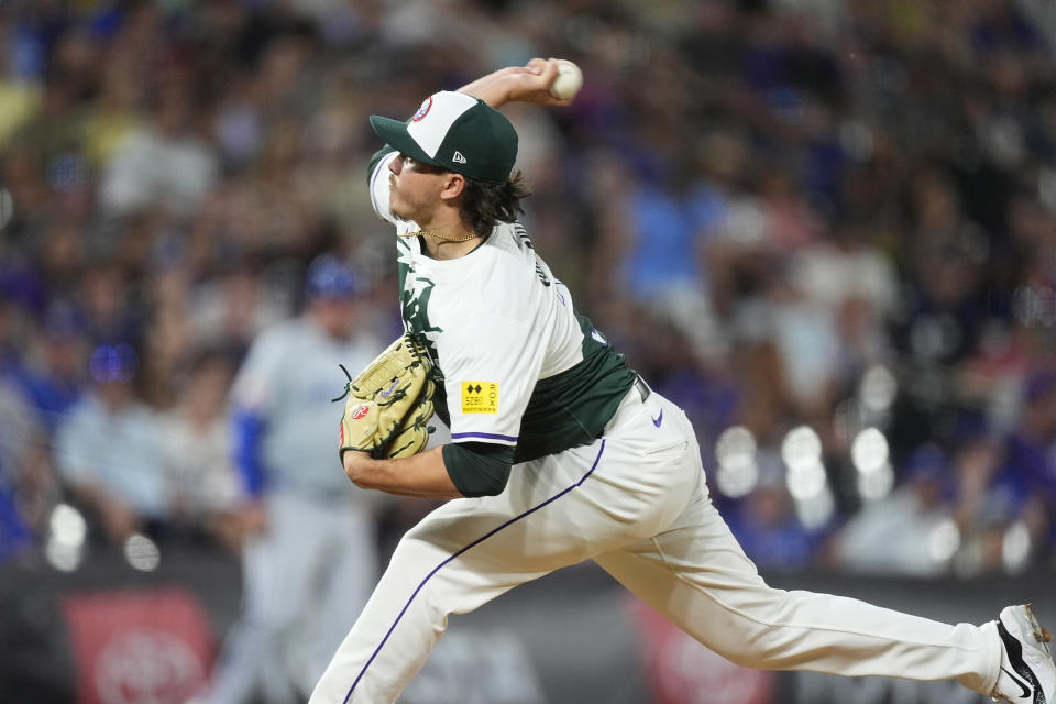 Colorado Rockies relief pitcher Victor Vodnik works against the Kansas City Royals in the ninth inning of a baseball game Saturday, July 6, 2024, in Denver. (AP Photo/David Zalubowski)