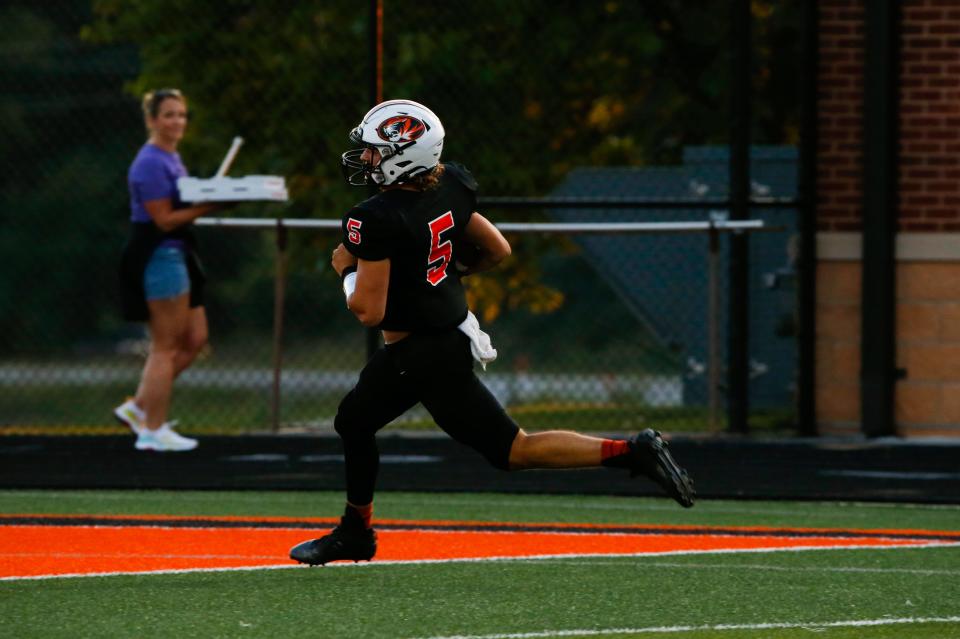 Republic Tiger Wyatt Woods carries the ball for a touchdown as the Tigers take on the Neosho Wildcats at Republic on Friday, Sept. 16, 2022. 