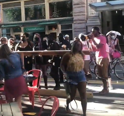 Protesters confront diners in Pittsburgh (Facebook)