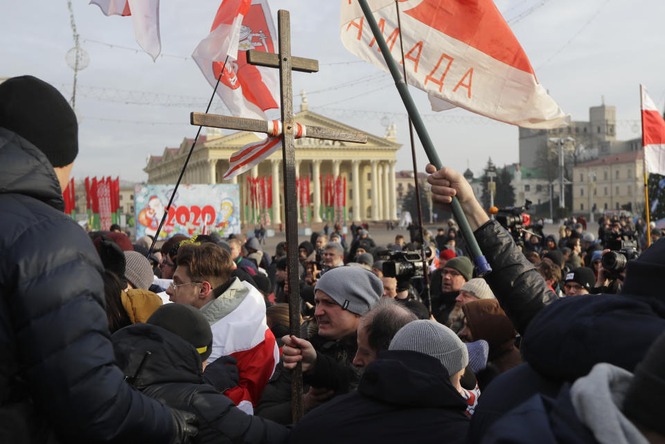 Protesters attend a rally in downtown Minsk, Belarus, Saturday, Dec. 7, 2019. More than 1,000 opposition demonstrators are rallying in Belarus to protest closer integration with Russia. Saturday's protest in the Belarusian capital comes as Belarusian President Alexander Lukashenko is holding talks with Russian President Vladimir Putin in Sochi on Russia's Black Sea coast. (AP Photo/Sergei Grits)
