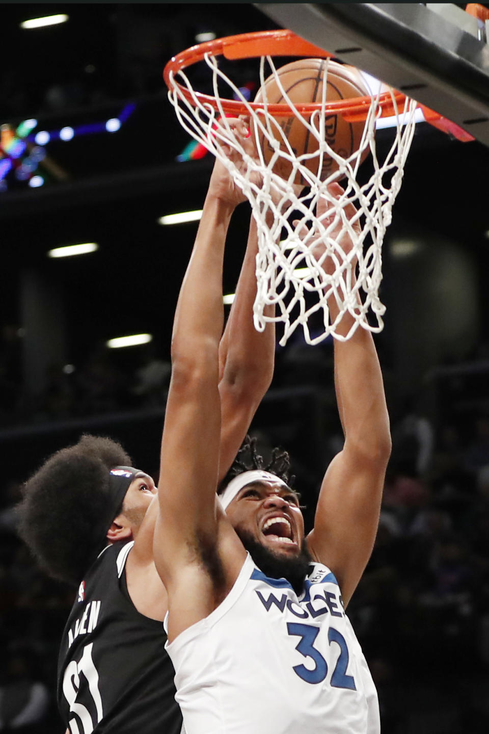 Brooklyn Nets center Jarrett Allen (31) defends against Minnesota Timberwolves center Karl-Anthony Towns (32) during the first half of an NBA basketball game Wednesday, Oct. 23, 2019, in New York. (AP Photo/Kathy Willens)