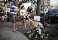 <p>People add flowers and messages to a memorial remembering the victims of Sunday’s shooting in Toronto on Monday, July 23, 2018. (Photo: Mark Blinch/The Canadian Press via AP) </p>