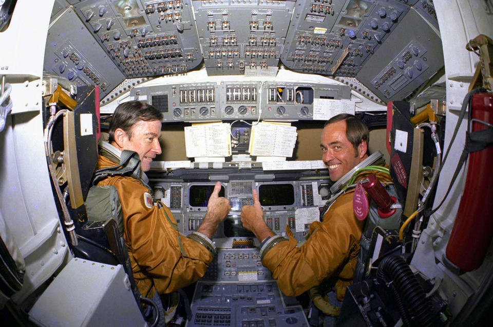 STS-1 crewmates John Young and Bob Crippen give a 'thumbs-up' aboard the space shuttle Columbia's flight deck in 1981. <cite>NASA</cite>