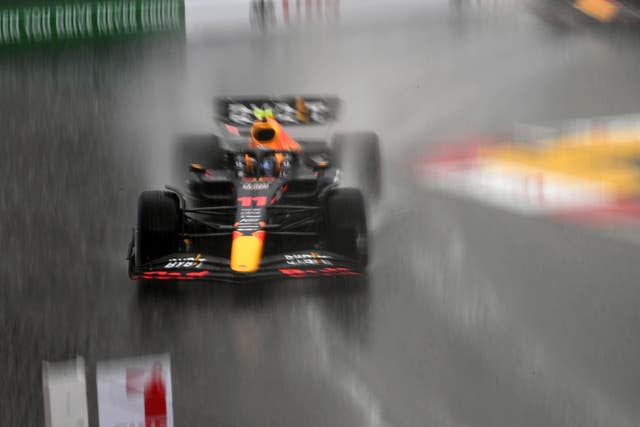 Sergio Perez drives in the rain in Monaco