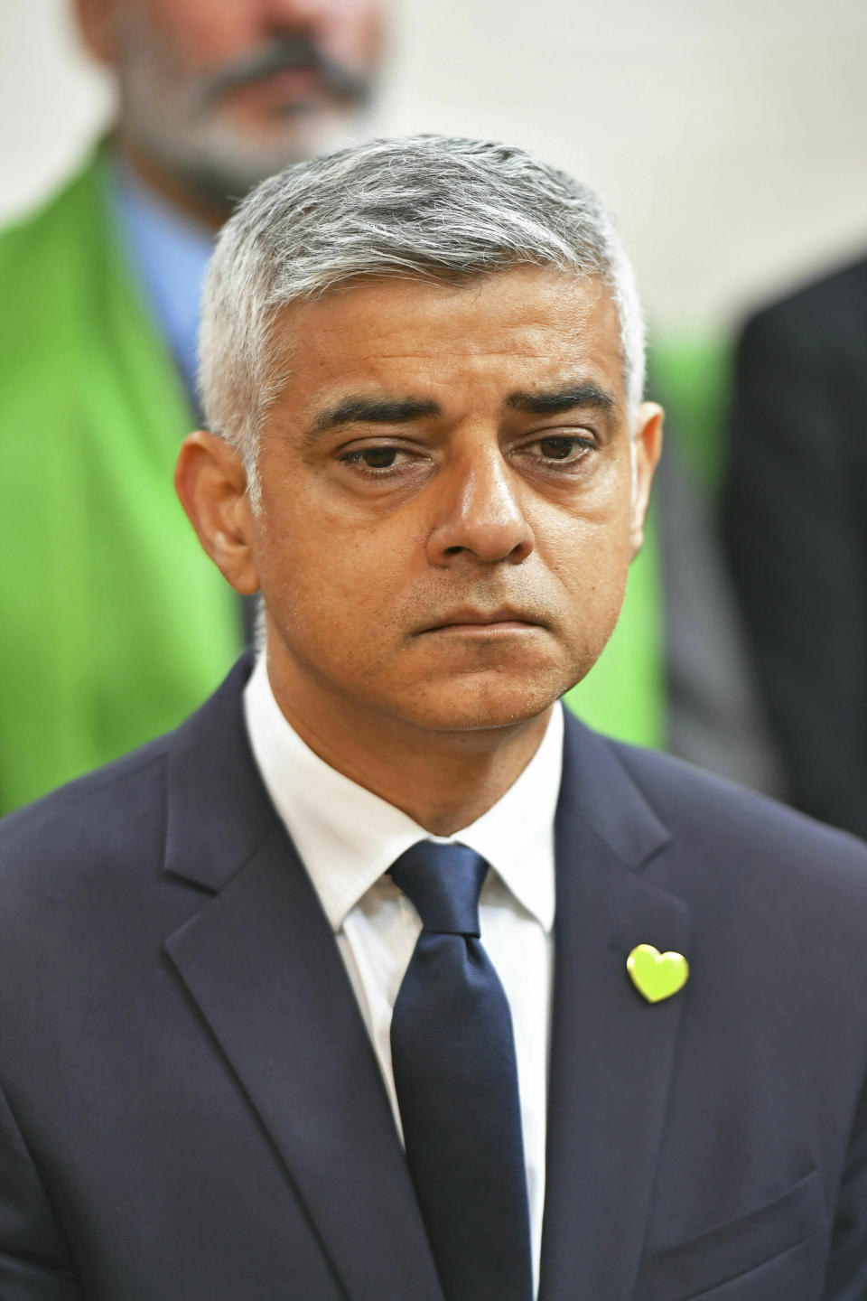 Mayor of London Sadiq Khan attends a service of remembrance at St Helen's church to mark the two-year anniversary of the Grenfell Tower apartment block fire, near to the site of the fire in London, Friday June 14, 2019. Two years after the 24-storey tower-block fire that killed 72 people, campaigners say hundreds of apartment buildings remain at risk of a similar blaze. (Dominic Lipinski/PA via AP)