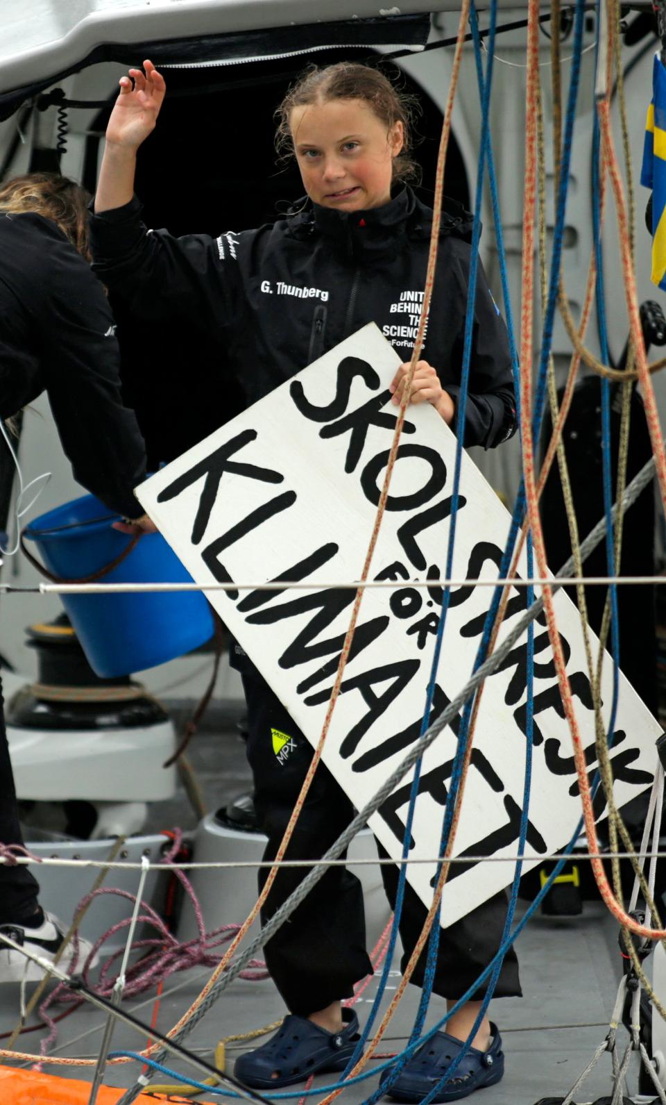 Swedish climate activist Greta Thunberg, 16, arrives in the US after a 15-day journey crossing the Atlantic in the Malizia II, a zero-carbon yacht, on August 28, 2019 in New York. - "Land!! The lights of Long Island and New York City ahead," she tweeted early Wednesday. She later wrote on Twitter that her yacht had anchored off the entertainment district of Coney Island in Brooklyn to clear customs and immigration. (Photo by Kena Betancur / AFP)        (Photo credit should read KENA BETANCUR/AFP via Getty Images)