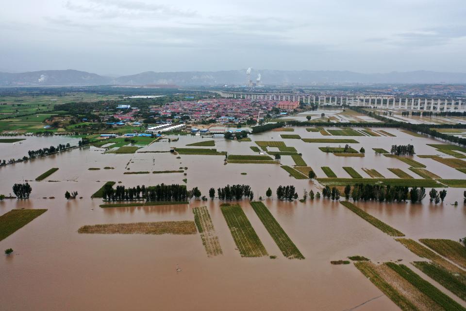 Aerial photo shows mass flooding of fields and a town. (Source: Getty)