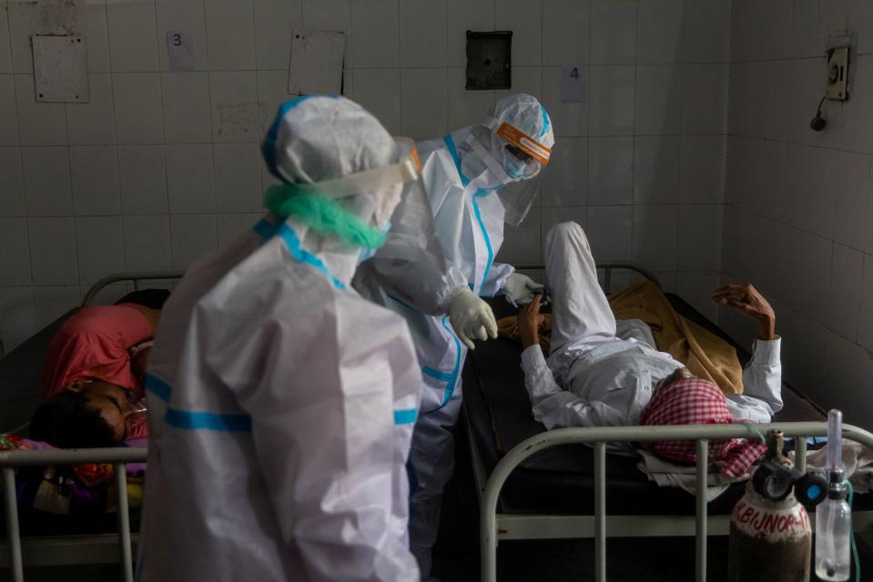 <p>Patients receive treatment inside a Covid-19 ward of a government-run hospital in Bijnor district, Uttar Pradesh</p> (AP)