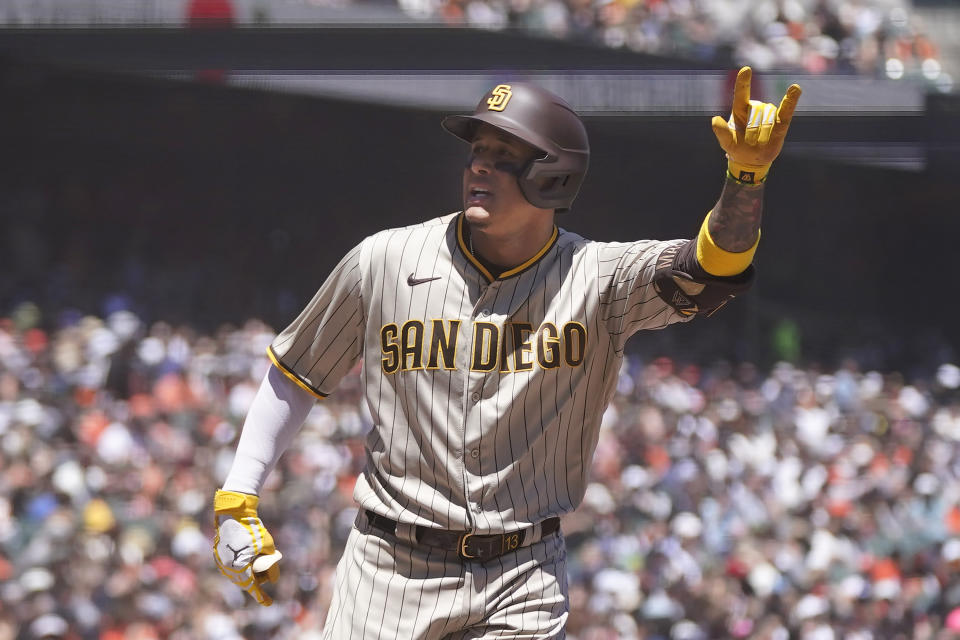 San Diego Padres' Manny Machado celebrates after hitting a home run against the San Francisco Giants during the third inning of a baseball game in San Francisco, Saturday, May 21, 2022. (AP Photo/Jeff Chiu)