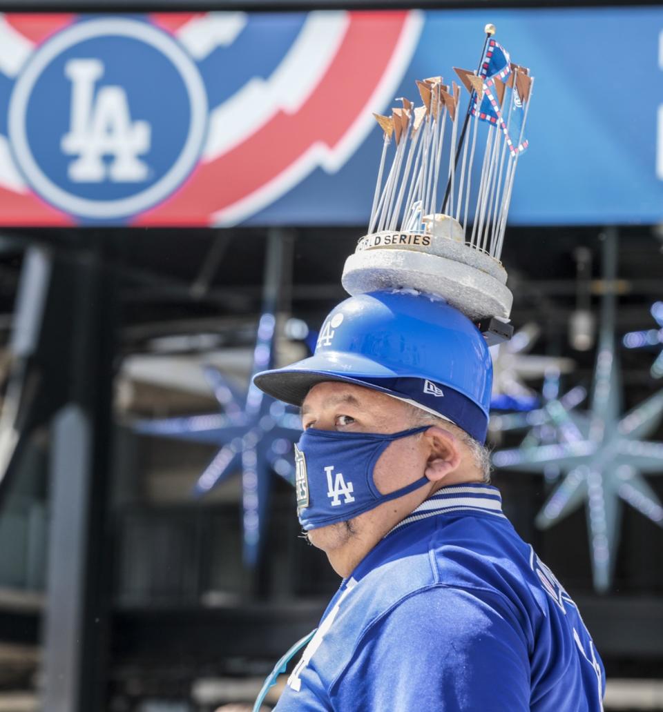 Dodgers fan Alberto Valenzuela of Huntington Park checks out the sights in the center field pavilion during opening day.