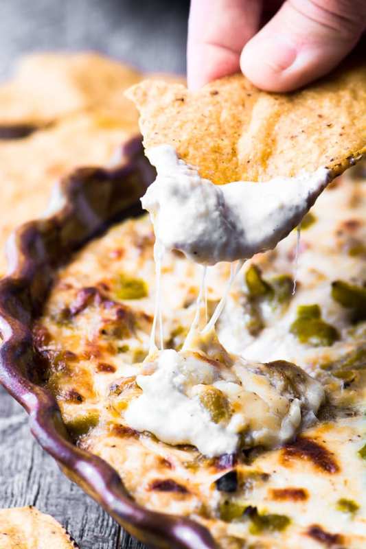 <p>The View from Great Island</p><p>Cheesy hatch green chile dip is pretty much the ultimate appetizer for all you chile heads out there who also appreciate the finer points of gooey cheese and the salty crunch of a great tortilla chip. This hot appetizer is a party in a bowl!</p><p><strong>Get the recipe: <a href="https://theviewfromgreatisland.com/cheesy-hatch-green-chile-dip-recipe/" rel="nofollow noopener" target="_blank" data-ylk="slk:Cheesy Hatch Green Chile Dip;elm:context_link;itc:0;sec:content-canvas" class="link ">Cheesy Hatch Green Chile Dip</a></strong></p>