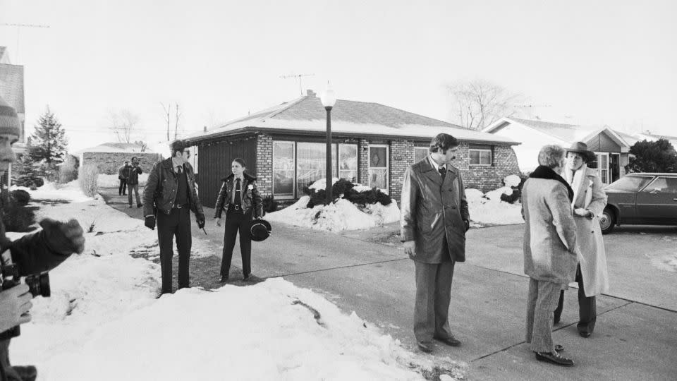 Police are seen on December 22, 1978, surrounding the home of the serial killer John Wayne Gacy, where the bodies of a number of his victims were found. - Bettmann Archive/Getty Images
