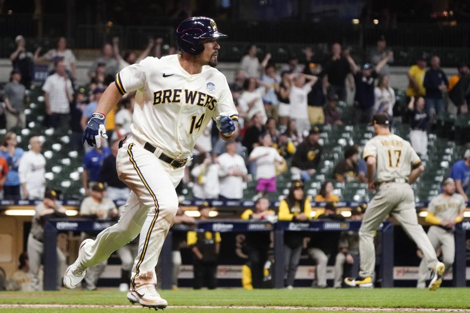 Milwaukee Brewers' Jace Peterson hits a three-run scoring triple during the ninth inning of a baseball game against the San Diego Padres Thursday, June 2, 2022, in Milwaukee. (AP Photo/Morry Gash)