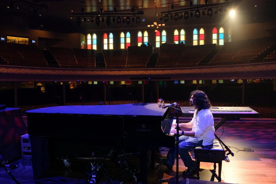 Pianist and organist Kiran Gupta inside the Ryman Auditorium, 2023