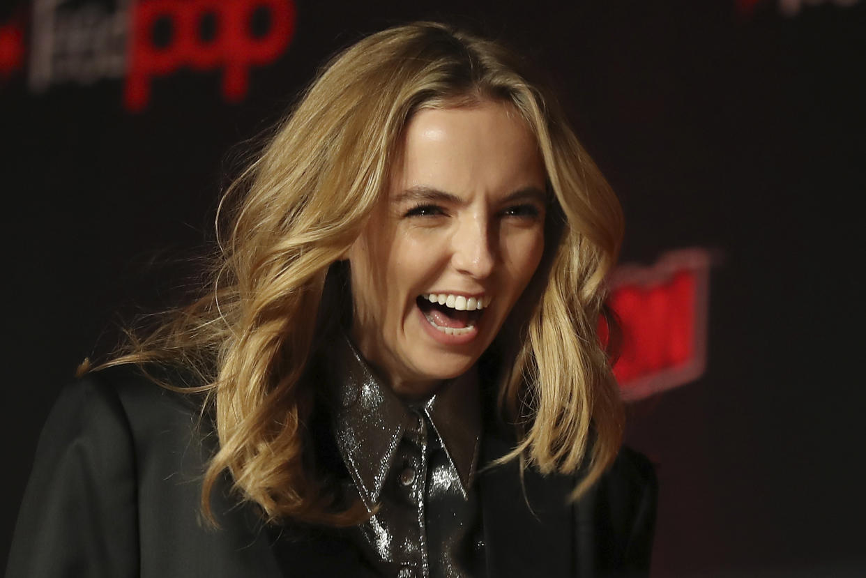 Jodie Comer walks on stage during the 20th Century Fox Panel: An Insider's Look at "The King's Man" and "Free Guy" on the first day of New York Comic Con, Thursday, Oct. 3, 2019, in New York. (AP Photo/Steve Luciano)