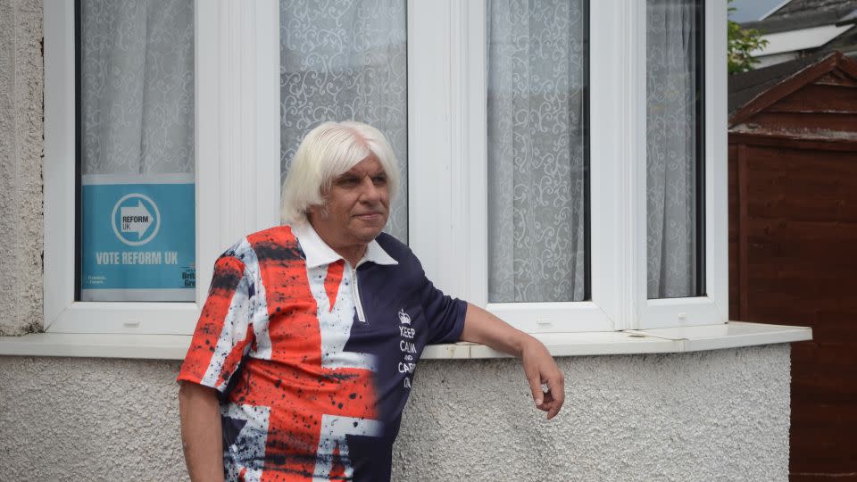 Bob Brace attended Farage's rally last week, and has helped Reform's campaign by handing out leaflets in town. "As you can tell from the T-shirt, I’m Britain first," he says. - Rob Picheta/CNN