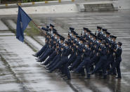 Hong Kong police show their new goose step marching style on the National Security Education Day at a police school in Hong Kong Thursday, April 15, 2021. Authorities in Hong Kong are marking the day with a police college open house, where police personnel demonstrated the Chinese military's "goose step" march, replacing British-style foot drills. The "goose step" march is one in which troops swing their legs off the ground in unison, keeping each leg straight. (AP Photo/Vincent Yu)