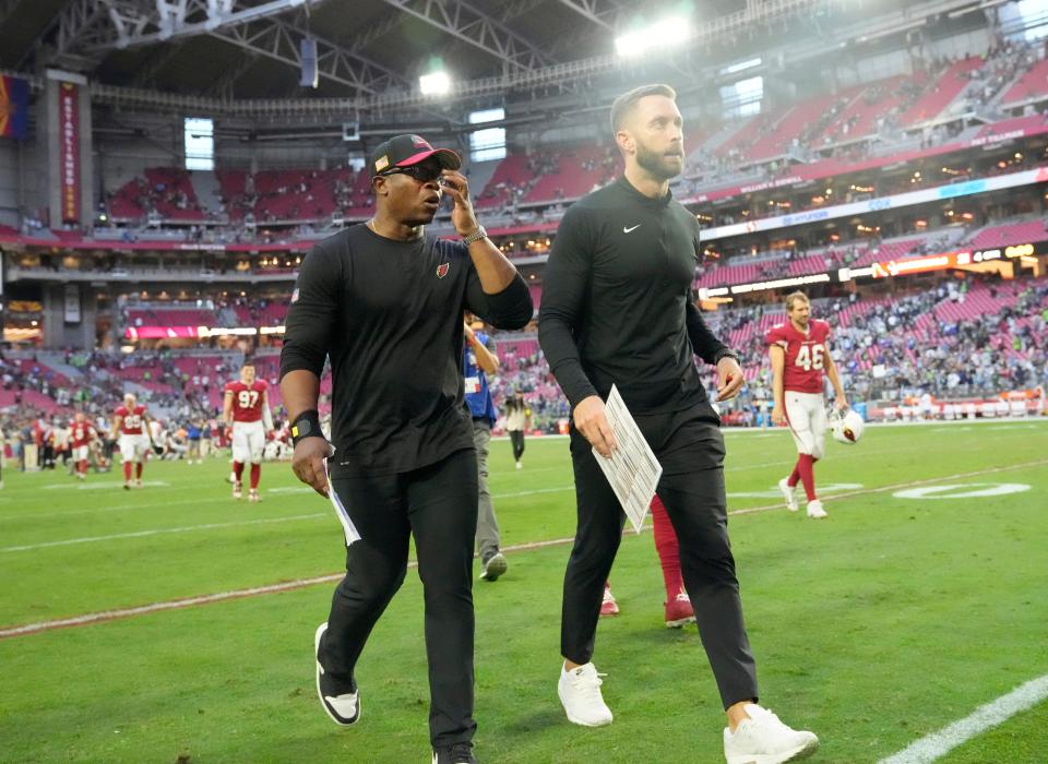 Nov 6, 2022; Phoenix, Ariz., United States;  Arizona Cardinals defensive coordinator Vance Joseph (left) and head coach Kliff Kingsbury walk off the field after losing 31-21 against the Seattle Seahawks at State Farm Stadium.