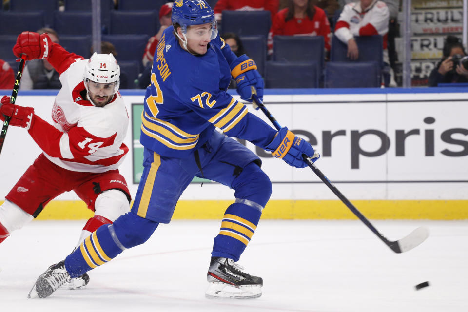 Buffalo Sabres right wing Tage Thompson (72) carries the puck past Detroit Red Wings center Robby Fabbri (14) during the first period of an NHL hockey game, Saturday, Nov. 6, 2021, in Buffalo, N.Y. (AP Photo/Jeffrey T. Barnes)