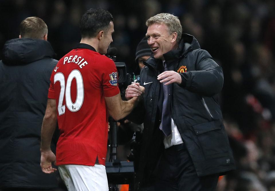 Manchester United's manager David Moyes (R) celebrates with Robin van Persie after their English Premier League soccer match against Arsenal at Old Trafford in Manchester, northern England, November 10, 2013.