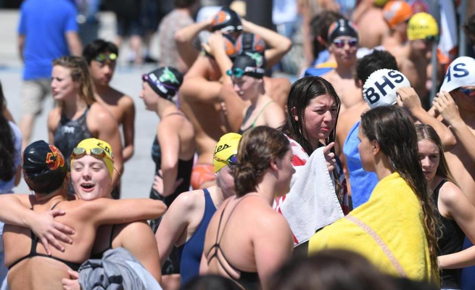 Swimmers gather behind the starting blocks at the Clovis West Invitational Saturday, April 15, 2023 in Fresno. Clovis Unified’s Olympic Swim Complex at Clovis West opened this week after being closed almost a year for renovation and construction. ERIC PAUL ZAMORA/ezamora@fresnobee.com